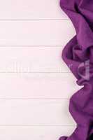 Purple towel over wooden table