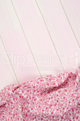 Pink towel over wooden table