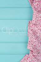 Pink towel over wooden table