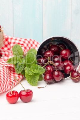 Cherries in small metal bucket