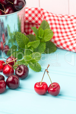 Cherries in blue wooden table