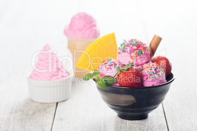 Pink ice cream with strawberry fruits