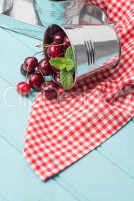 Cherries in blue wooden table