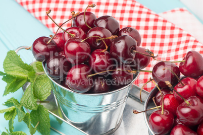 Cherries in blue wooden table