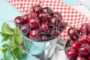 Cherries in blue wooden table