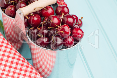 Cherries in blue wooden table