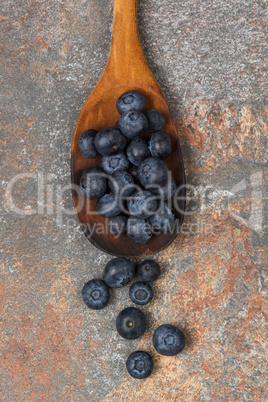 Blueberries on a wooden spoon