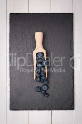 Blueberries on a wooden spoon