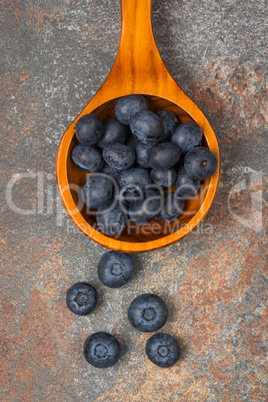 Blueberries on a wooden spoon