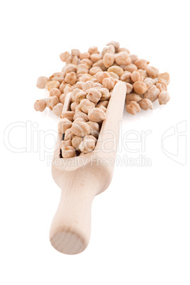 Uncooked chickpeas and wooden scoop