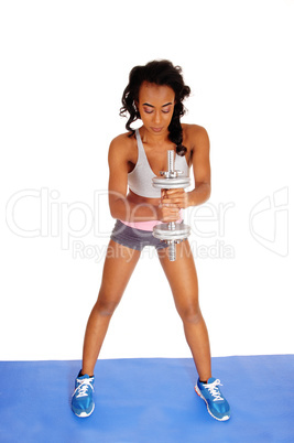 African American lady exercising with dumbbell's.