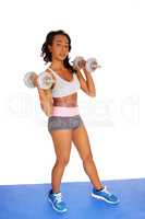 Young African American girl with dumbbell's.