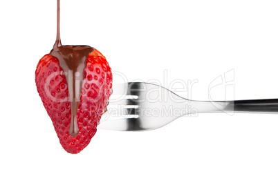 Strawberry and chocolate on a fork