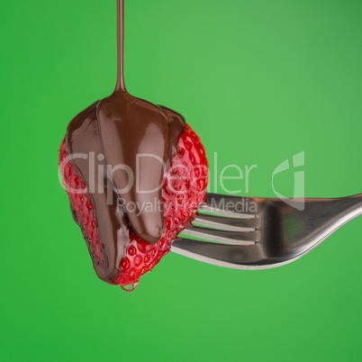 Strawberry and chocolate on a fork