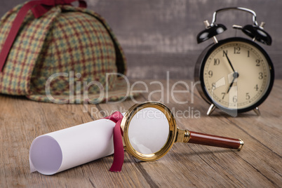 Wrapped paper sheets and magnifying glass