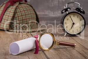 Wrapped paper sheets and magnifying glass
