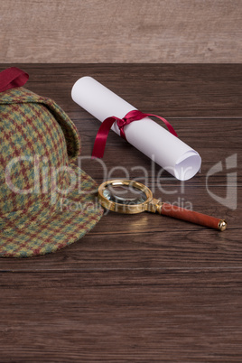 Wrapped paper sheets and magnifying glass