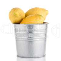 Bucket with lemons