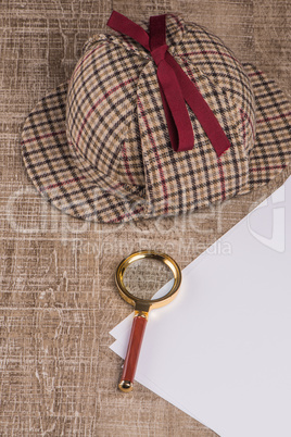 Wrapped paper sheets and magnifying glass