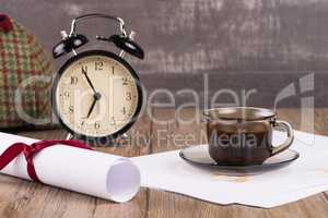 Old clock, hat, coffee and paper sheets