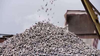 crushed rock gravel on the conveyor