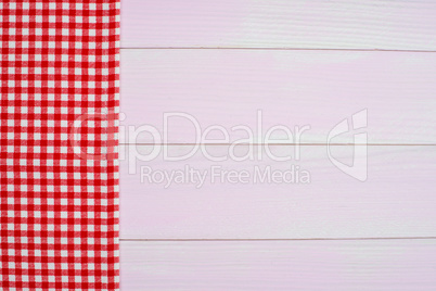 Red towel over wooden table