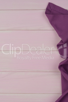 Purple towel over wooden table