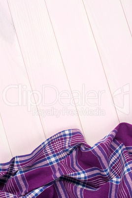 Purple towel over wooden table