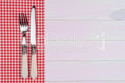 Kitchenware on red towel