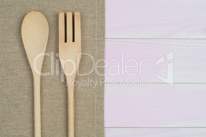 Kitchenware on beige towel