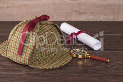 Wrapped paper sheets and magnifying glass