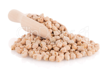 Uncooked chickpeas and wooden scoop