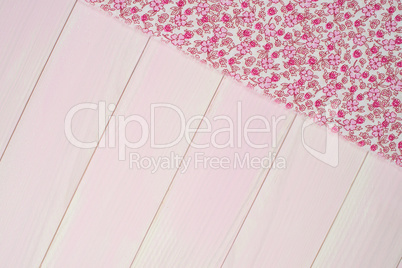 Pink towel over wooden table