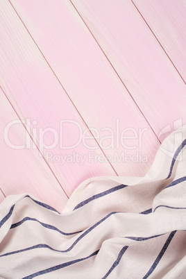 White and blue towel over wooden table
