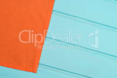 Orange towel over wooden table