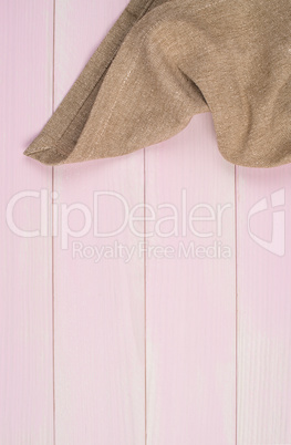 Beige towel over wooden table