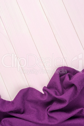 Purple towel over wooden table