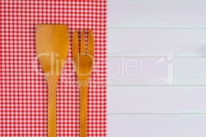 Kitchenware on red towel