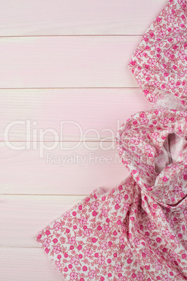 Pink towel over wooden table