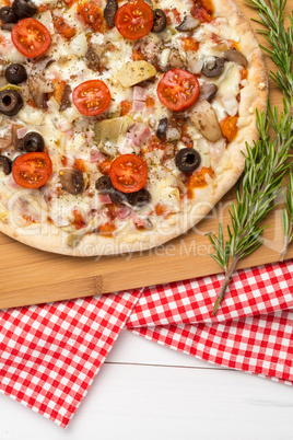 Pizza with bacon, olives and tomato