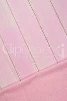 Pink towel over wooden table