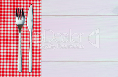 Kitchenware on red towel