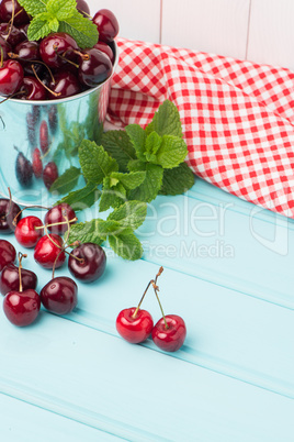 Cherries in blue wooden table