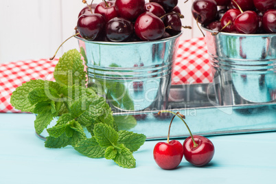 Cherries in blue wooden table