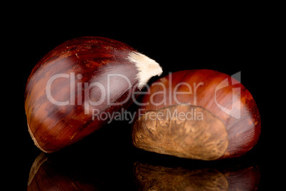 Chestnuts on a black reflective background