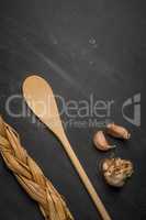 Wooden spoon and garlic
