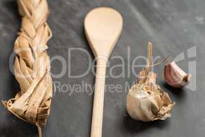 Wooden spoon and garlic