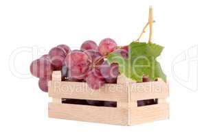 Red grapes in wooden crate