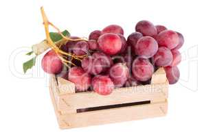 Red grapes in wooden crate
