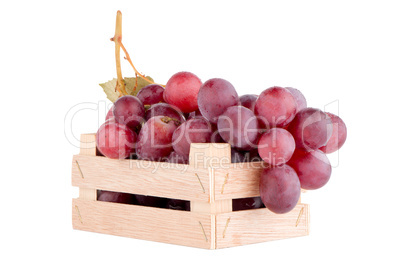 Red grapes in wooden crate